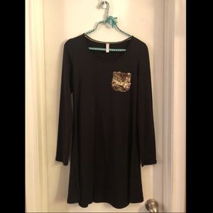 Black long-sleeve dress with gold sequin pocket